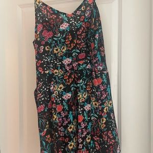 Cute Express romper with side zip and tie waist.